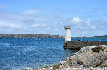 Camaret sur Mer, France, little ancient light house with view to the brittany coast