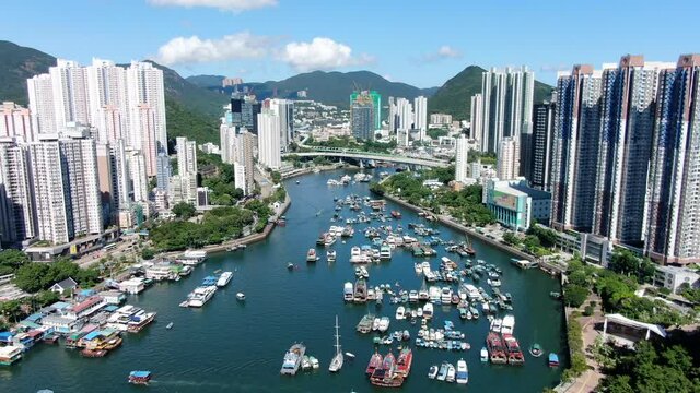 Aberdeen harbour and skyline in southwest Hong Kong island on a beautiful day, Aerial view.