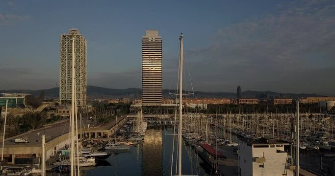 Aerial Truck Right Upwards of Mapfre Tower, Port Olimpic and Agbar Tower