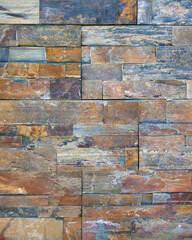 Full frame close-up partial view of a wall built of wooden bricks