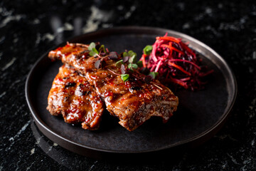 Toskana steak with pink grated beetroot and carrot salad, top view on marble background