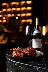 French restaurant menu: sous vide meat served on a table, side view