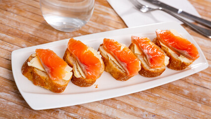 Salmon toasts with butter. Delicious lunch, healthy food, fish sandwich, diet snack