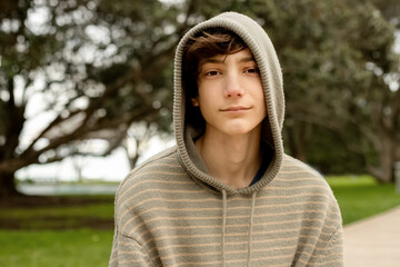 portrait of teenager boy on natural background. adolescence and youth concept. casual look 