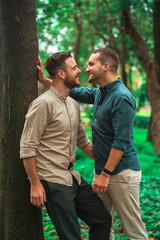 gay couple looking at each other on the park