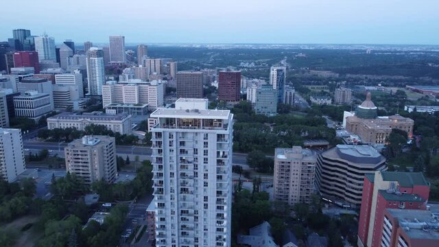 The Hendrix downtown Edmonton in the Oliver district next to Government ETS subway station surrounded by parks, trees, and overlooking the river valley area.
