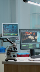 Biochemistry desk with scientific computer in laboratory for blood and dna animation. Empty room with technology used for medical research and biology equipment for investigation