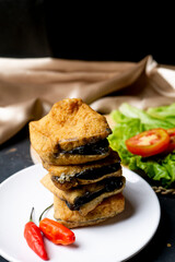 Tahu Petis Susur, the typical food of Semarang City, Indonesia on white plate