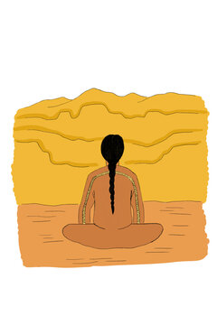 Indigenous man sitting on the ground and staring at landscape