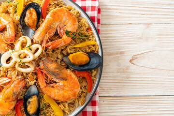 Seafood Paella with prawns, clams, mussels on saffron rice