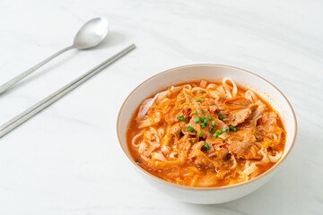 Korean udon ramen noodles with pork in kimchi soup