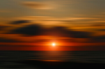 Fototapeta na wymiar Colorful blurred sunset sky background.
