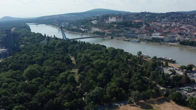 Wide aerial descending shot of Bratislava, capital of Slovakia - summer sunny day