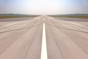 Runway sign markings and landing lights on the tarmac of runway at a international commercial airport