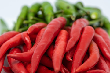 Red and green hot chili peppers isolated on white background.