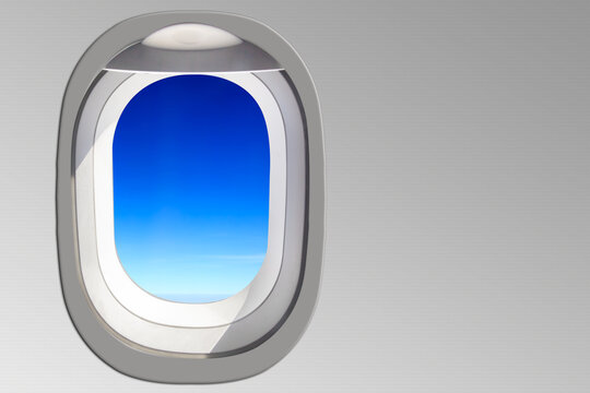 Window cabin of airplane and blue sky concept for transportation and travel around the world.
