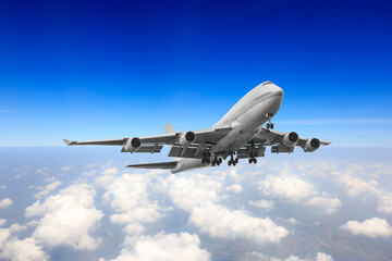 Passenger aircraft flying high above the clouds prepared landed at the runway