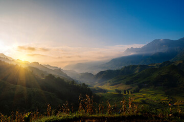 Beautiful Mountain landscape foggy windy mountain range green landscape asian farm. Amazing Landscape mountain green field meadow white cloud blue sky on sunrise. Countryside sunlight heaven scenery