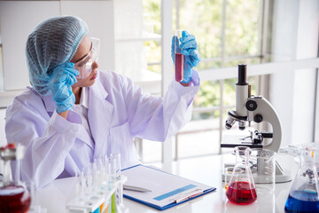 Woman scientist in lab look at science microscope medical test and research biology chemistry. Females technician laboratory analyzing scientific pharmacy genetic research. Chemistry Medical test lab