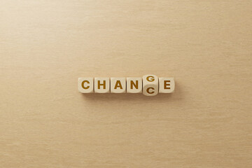 Wooden cube flip with word change to chance. Personal development and career growth or change...