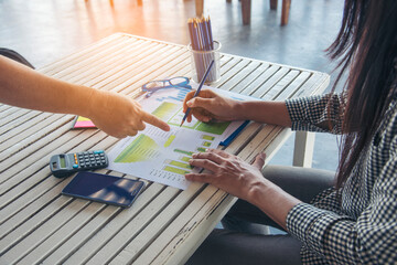 Woman working business office desk using laptop work from home. Businesswoman looking financial business chart, graph, infographic analyze sale statistics. Woman hands on entrepreneur office desk