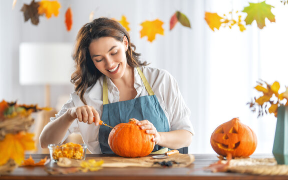 Woman Is Carving Pumpkin