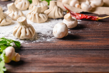 Georgian dumpling or Khinkali. Georgian homemade khinkali on wooden background.