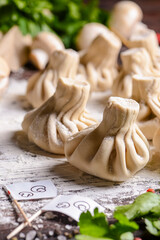 Georgian dumpling or Khinkali. Georgian homemade khinkali on wooden background.