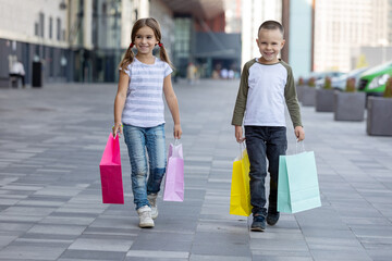 Two cute preschool children shoping in mall.