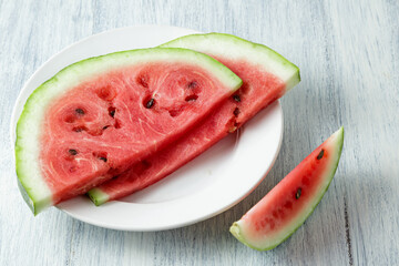 Waterelon, honey watermelon on wooden table background.