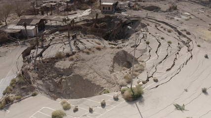 Large sinkhole close to house In the desert, Aerial view
drone view from dead sea sinkhole, Israel...