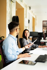 Portrait of a businessman working on laptop. Handsome man working in the office