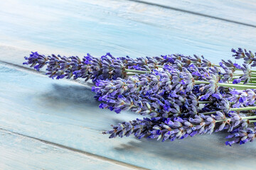 Lavender flower bouquet on a rustic wooden background, a bunch of lavandula plants, medicinal herb