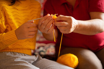 girl learning to crochet