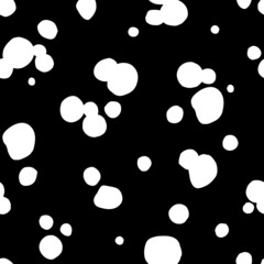 Polka dot seamless pattern. White spots on black background. Hand drawn texture for print, textile, packaging.