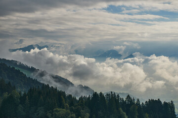 Mountain panorama between clouds and fog