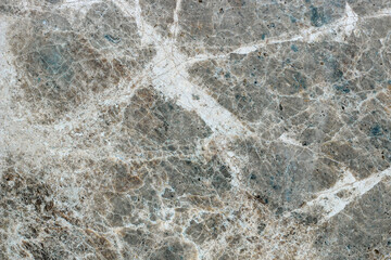 Marble stone texture with varied pattern with fine lines.