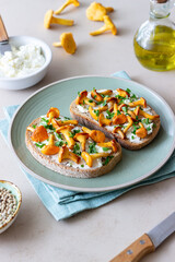 Bruschetta with mushrooms chanterelles and white cheese. Healthy eating. Vegetarian food.