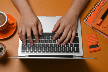 Fototapeta na wymiar Above view man hands typing on laptop computer.