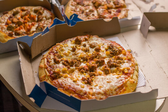West Bangal, India - August 21, 2021 : Dominos pizza on box stock image.
