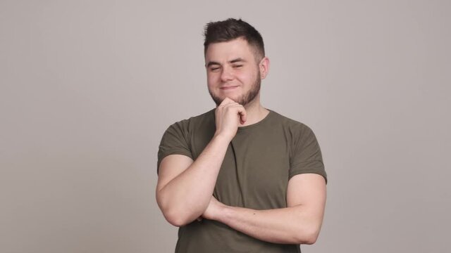 Young man warning with finger gesture, making disapproval gesture