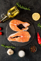 raw salmon steak on stone background