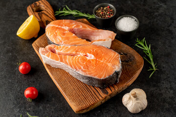 raw salmon steak on stone background