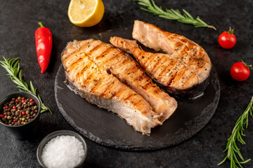 grilled salmon steak on stone background 