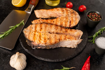 grilled salmon steak on stone background 