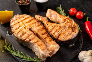 grilled salmon steak on stone background 