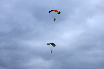 Skydiving. Parachute piloting. A parachute is in the sky.