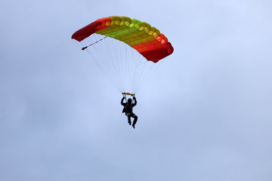 Skydiving. Parachute piloting. A parachute is in the sky.