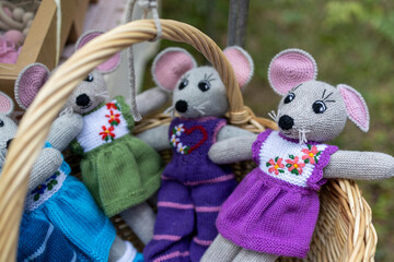 knitted and crocheted toys in a basket