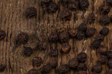 black pepper on wooden table